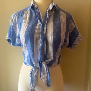 Shirt or crop top that is fitted around waist and ties in the front.